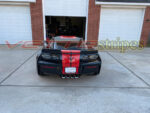 Black C7 Z06 Corvette with GM full length dual racing ME stripes in red