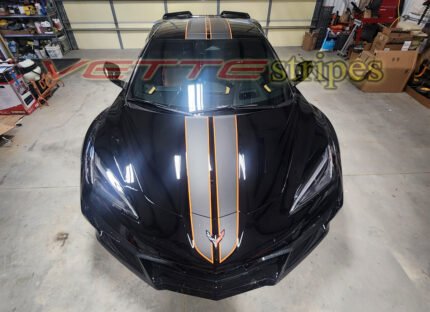 Black C8 Corvette Z06 with matte carbon flash and amplified orange full length dual racing stripes