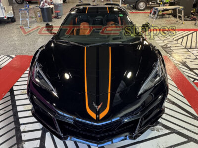 Black C8 Z06 Corvette with 3M 2080 gloss carbon flash and Habanero full length dual racing stripes