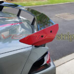 C8 Corvette with gloss edge red high rise spoiler end cap