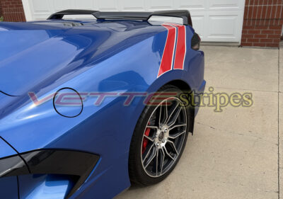 Riptide blue C8 Corvette Stingray with grand sport heritage rear fender hash stripes in gloss red and satin pearl white