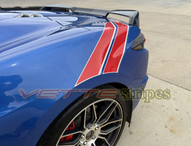 Riptide blue C8 Corvette Stingray with grand sport heritage rear fender hash stripes in gloss red and satin pearl white