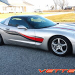 Silver C5 Corvette with black carbon fiber and red side stripes