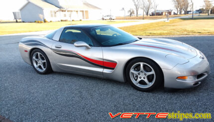 Silver C5 Corvette with black carbon fiber and red side stripes