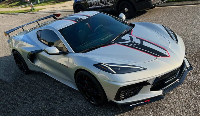 Silver C8 Corvette coupe with gloss carbon flash stinger and edge red border