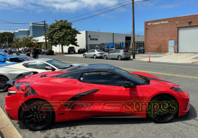 Torch red C8 Corvette HTC with gloss carbon flash rear fender hash stripes