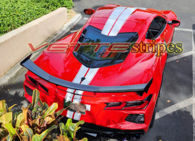 Torch red C8 Stingray coupe with white ME full length dual racing stripes