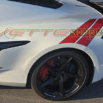 White C8 Corvette Eray with rear Grand Sport fender hash stripes on gloss red and gloss carbon flash