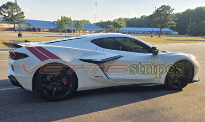 White C8 Corvette Eray with rear Grand Sport fender hash stripes on gloss red and gloss carbon flash