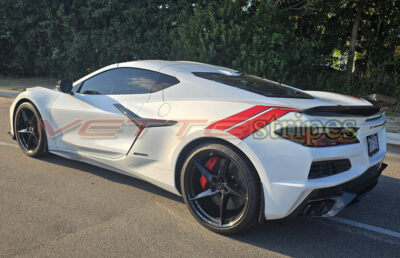 White C8 Corvette Eray with rear Grand Sport fender hash stripes on gloss red and gloss carbon flash