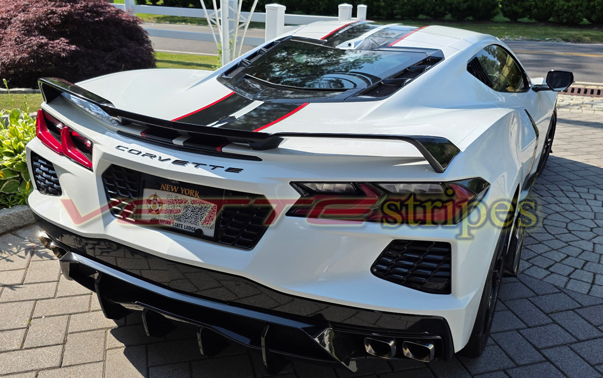 White C8 Corvette Stingray with GM full length dual racing stripes in carbon flash and red White C8 Corvette Stingray with GM full length dual racing stripes in carbon flash and red