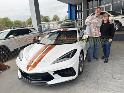 White C8 Corvette with 2024 full length dual racing stripes in Texas Longhorn orange