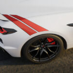 White Corvette Grand Sport with rear fender hash stripes