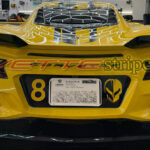 Yellow C8 Corvette Z06 Eray with rear plate blackout